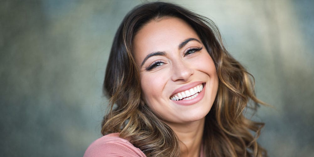 woman after getting dental implants in Beverly Hills