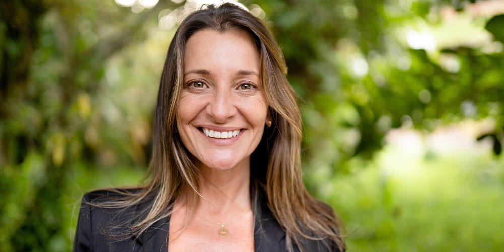 woman smiling after getting dental implants in Los Angeles, CA