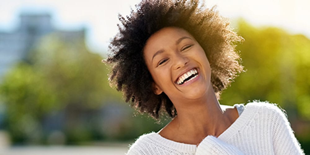 woman smiling after getting prepless veneers in Los Angeles, CA