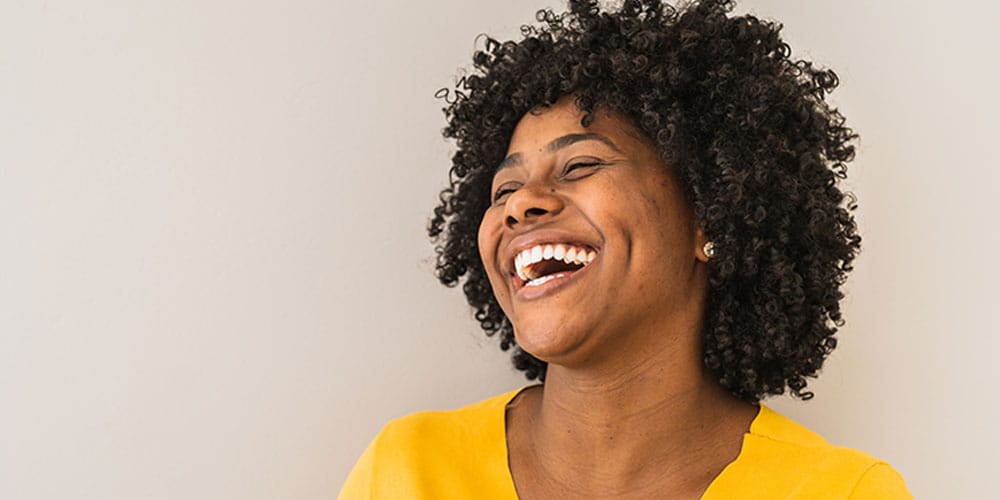 woman smiling after getting a smile makeover in Los Angeles, CA
