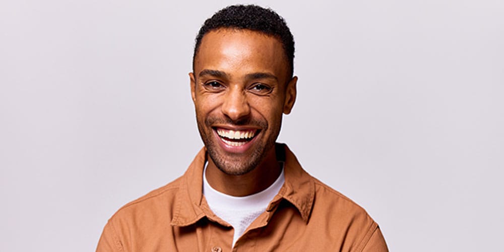 man smiling after getting full mouth dental treatment in Los Angeles, CA