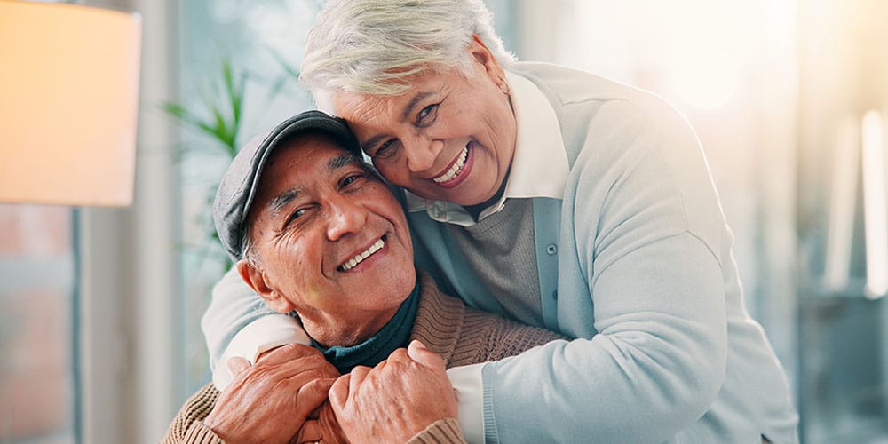 older couple smiling after getting dental implants in Los Angeles, CA