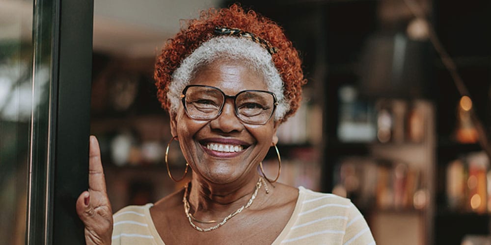 older woman smiling after her smile makeover in Los Angeles, CA